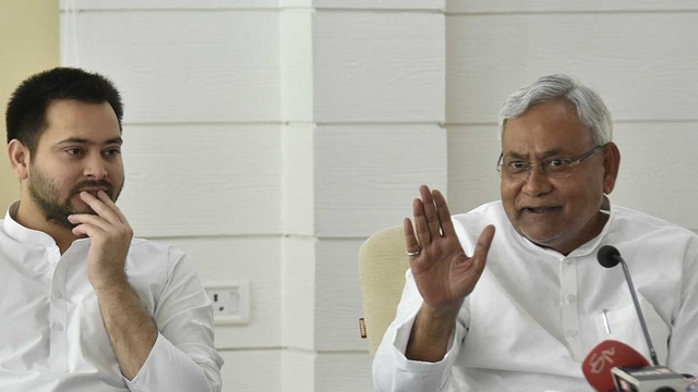 Bihar Chief Minister Nitish Kumar interacting with people during Lok Samvad programme as Deputy Chief Minister  Tejashwi Yadav looks on. (Santosh Kumar/Hindustan Times via GettyImages) &nbsp;