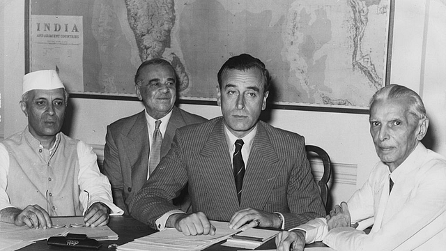 Nehru, left, and Jinnah, right, look on as Lord Mountbatten, centre, discloses Britain’s Partition plan for India. (Keystone/GettyImages)