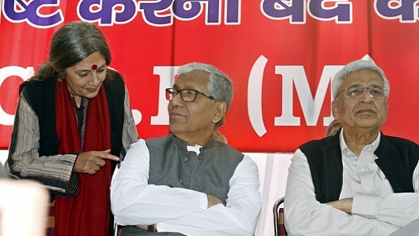 Tripura Chief Minister Manik Sarkar with CPI(M) General Secretary Prakash Karat and Political Bureau Member Brinda Karat at Jantar Mantar, New Delhi. (Arun Sharma/ Hindustan Times via Getty Images)