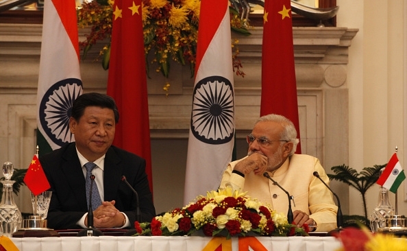 Prime Minister Narendra Modi and Chinese President Xi Jinping at the agreement signing ceremony at Hyderabad House on 18 September 2014 in New Delhi. (Arvind Yadav/Hindustan Times via GettyImages)