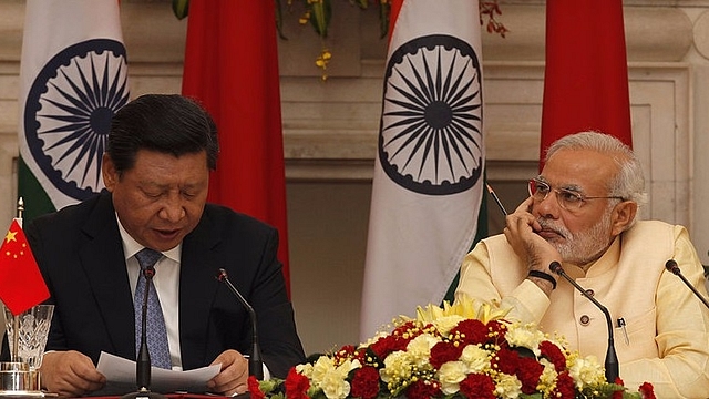 Xi Jingping and Narendra Modi (Arvind Yadav/Hindustan Times via Getty Images)