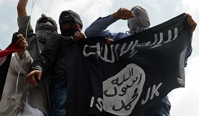 IS flags being waved in Kashmir in 2014. (TAUSEEF MUSTAFA/AFP/GettyImages) 