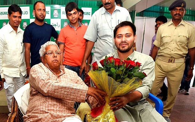 RJD leader Lalu Prasad Yadav with son Tejashwi Yadav (File Photo, Arun Sharma/Hindustan Times via Getty Images)