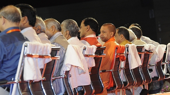 Uttar Pradesh Chief Minister Yogi Adityanath sits amid top ministers and officials at Rashtriya Panchayati Raj Diwas Programme. (Ashok Dutta/Hindustan Times via GettyImages)