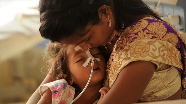 A child admitted inside the encephalitis ward at BRD Medical Centre, Gorakhpur, on 15 August 2017. (Deepak Gupta/Hindustan Times via Getty Images)