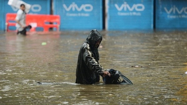 Heavy rain brought India’s financial capital Mumbai to a virtual standstill on 29 August. (PUNIT PARANJPE/AFP/Getty Images)