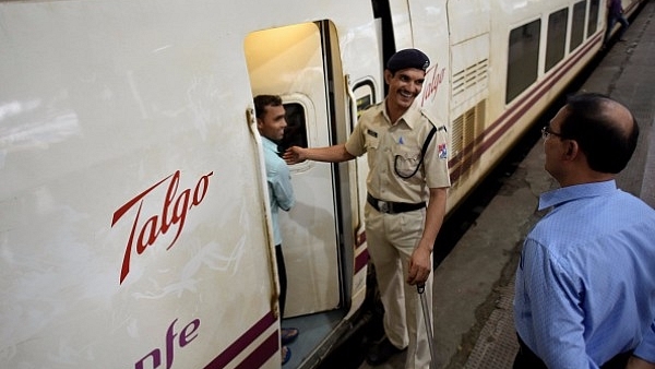 A security personnel stands on guard outside a coach of the Spanish Talgo Train (Arijit Sen/Hindustan Times via Getty Images)