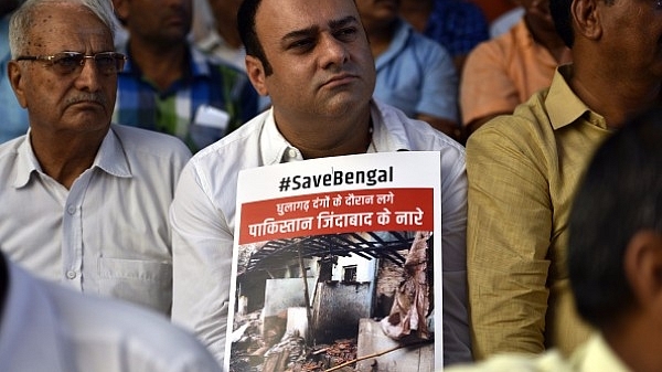 The BJP launched ‘Save Bengal’ protest against Mamata government at Rajghat in July, in New Delhi. (Arun Sharma/Hindustan Times via Getty Images)