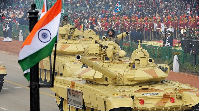 Indian military personnel drive Indian Army tanks as they take part in the Republic Day parade in New Delhi on January 26, 2014. (RAVEENDRAN/AFP/Getty Images)