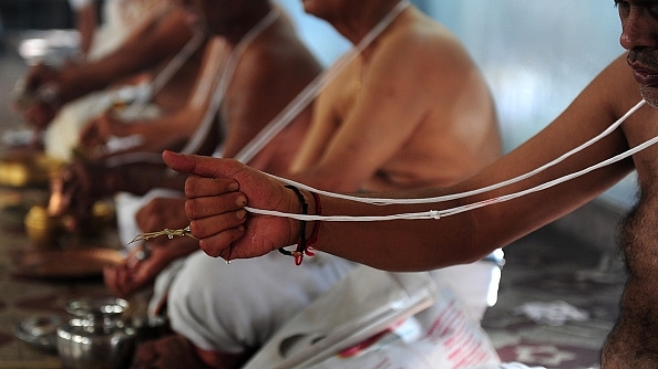 Brahmin community members perform a ritual on the occasion of ‘Aavani Avittam’ in Chennai. (ARUN SANKAR/AFP/GettyImages)