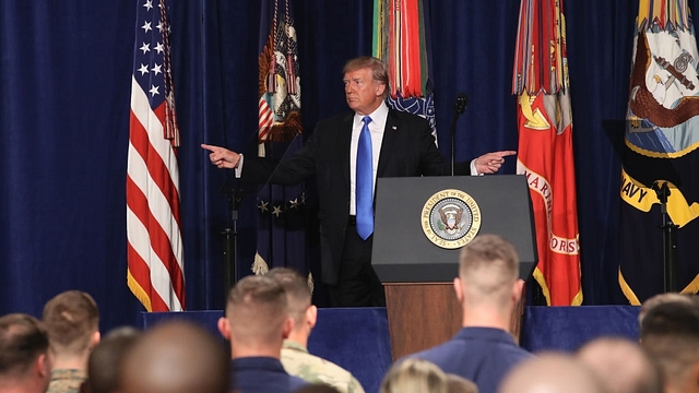 US President Donald Trump gestures before delivering remarks on America’s military involvement in Afghanistan at the Fort Myer military base on 21 August  2017 in Arlington, Virginia. (Mark Wilson/GettyImages)