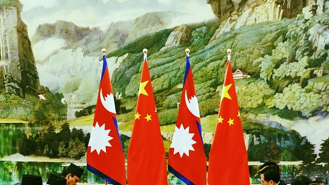 

Nepal and Chinese flags (Lintao Zhang/Pool/GettyImages)&nbsp;