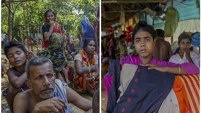 
Hindu villager, who crossed over from Myanmar into Bangladesh, say they were beaten by Rohingya Muslims. (AP Photo/Dar Yasin)







