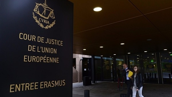 People walk away from the entrance of the European Court of Justice in Luxembourg. (JOHN THYS/AFP/Getty Images)