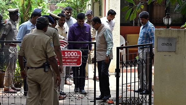 Special Investigation Team  investigates the spot where senior journalist Gauri Lankesh was killed. (Arijit Sen/Hindustan Times via Getty Images)