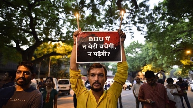  Students during a candle-light protest against the lathi charge on BHU students, at Jantar Mantar in New Delhi. (Arun Sharma/Hindustan Times via Getty Images)