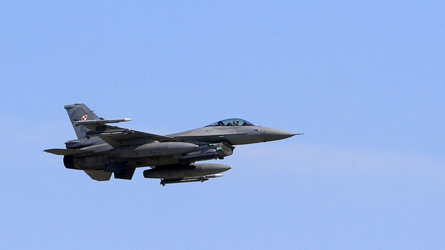 An F-16 fighter jet flies over the Siauliai Air Base during an exercise of NATO’s Baltic air-policing mission in Siauliai, Lithuania on 30 August.  (PETRAS MALUKAS/AFP/Getty Images)&nbsp;