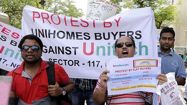 Home buyers of Noida, Greater Noida and Greater Noida west (Noida Extension) participated in a protest organised by Noida Estate Flat Owner Main Association (NEFOMA) at City Magistrate office Sector 19, on June 22, 2014 in Noida, India. Buyers handed over memorandum to City Magistrate for Prime Minister of India to bring attention on the issues of buyers who are waiting for their dream homes and facing many problems. (Burhaan Kinu/Hindustan Times via Getty Images)