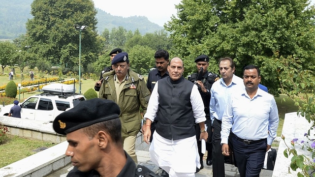 India’s Home Minister Rajnath Singh walks before a press conference in Srinagar on September 11, 2017. Singh is on a four-day visit to Jammu and Kashmir. Several rebel groups have spent decades fighting Indian soldiers deployed in the disputed territory, demanding independence or a merger with Pakistan, which also claims the Himalayan region in its entirety. (TAUSEEF MUSTAFA/AFP/Getty Images)