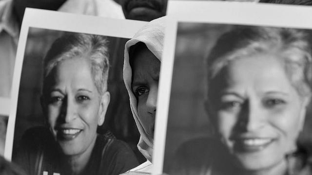 People stage a protest against the killing of senior journalist Gauri Lankesh, at Town Hall on September 6, 2017 in Bengaluru, India. (Arijit Sen/Hindustan Times via Getty Images)