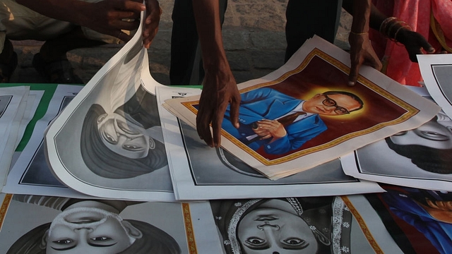 Photos of Ambedkar are being sold to people arriving to pay homage to Dr B R Ambedkar on his death anniversary on 6 December -
(Anshuman Poyrekar/Hindustan Times via Getty Images) &nbsp; &nbsp; &nbsp;