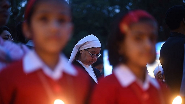 Students at a minority-run institution take part in a vigil in New Delhi. (SAJJAD HUSSAIN/AFP/GettyImages)