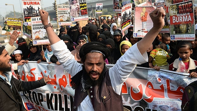 Rohingya Muslim refugees along with Indian supporters during a march to United Nations High Commissioner for Refugees (UNHCR) office in New Delhi on December 19, 2016. (PRAKASH SINGH/AFP/Getty Images)