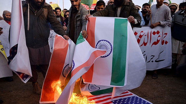 Pakistani supporters of the Jamaat-ud-Dawa organisation burn Indian  and US flags Islamabad. (AAMIR QURESHI/AFP/Getty Images)