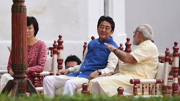 Prime Minister Narendra Modi (R) with Japanese Prime Minister Shinzo Abe (C) and his wife Akie Abe (L) during their visit to Sabarmati Ashram in Ahmedabad. (PRAKASH SINGH/AFP/Getty Images)