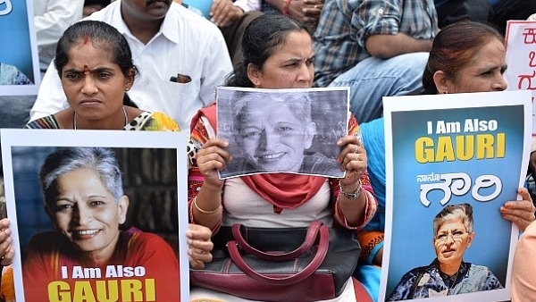 Indian protesters take part in a rally condemning the killing of journalist Gauri Lankesh in Bengaluru on 6 September  2017. (MANJUNATH KIRAN/AFP/Getty Images)