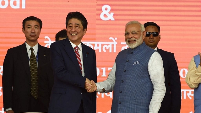 Prime Minister Narendra Modi and Japan’s Prime Minister Shinzo Abe shake hands during a ground-breaking ceremony for the Mumbai-Ahmedabad high speed rail project in Ahmedabad on 14 September 2017.  (SAM PANTHAKY/AFP/GettyImages)