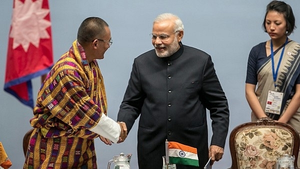 Bhutan Prime Minister Tshering Tobgay greets Narendra Modi during the inaugural session of the 18th SAARC Summit in Nepal. (Narendra Shrestha - Pool/Getty Images)