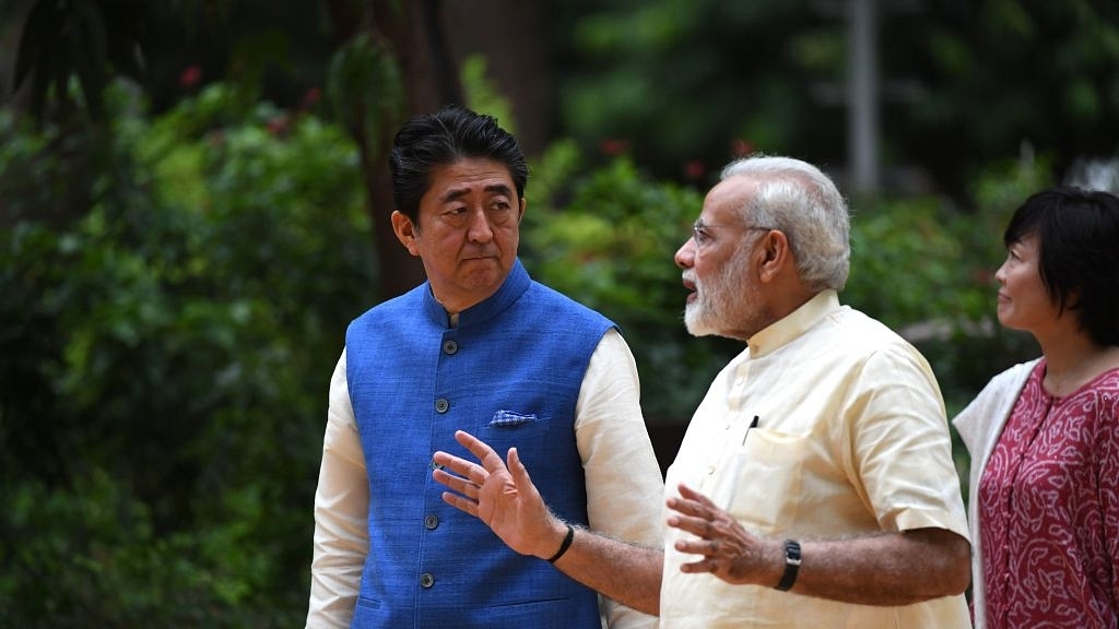 Japanese Prime Minister Shinzo Abe (L) with Prime Minister Narendra Modi (C) in Ahmedabad on 13 September 2017. (PRAKASH SINGH/AFP/GettyImages)