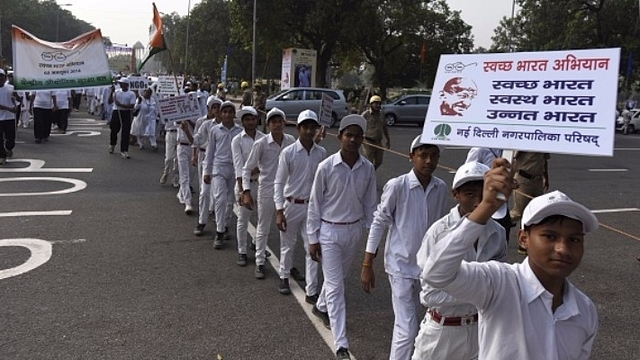 Students and workers participate during the Swachchta Rally flagged off by Union Minister Venkaiah Naidu at India Gate, in 2016, in New Delhi. (Sushil Kumar/Hindustan Times via Getty Images)