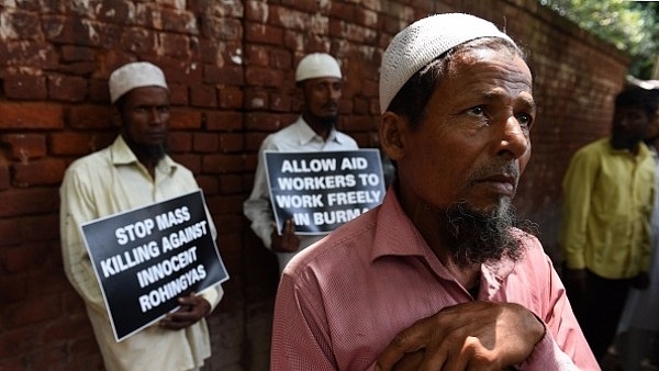 Rohingya Muslim refugees hold placards against human rights violations in Myanmar during a protest in New Delhi. (PRAKASH SINGH/AFP/Getty Images)