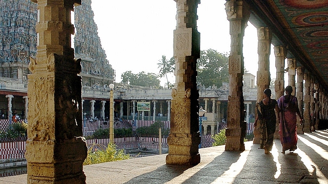 Devotees walk through a collonade at the Meenakshi Temple in Madurai (DIBYANGSHU SARKAR/AFP/Getty Images)