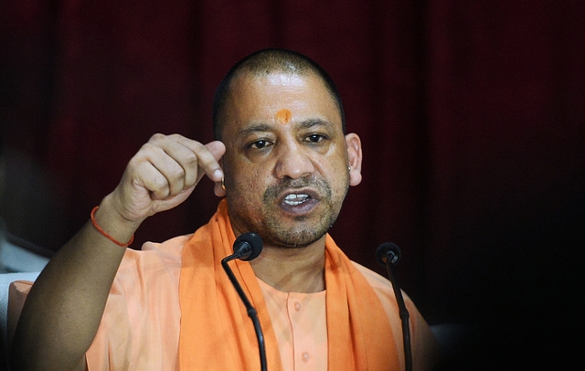 Chief Minister of Uttar Pradesh (UP), Yogi Adityanath gestures during a press confrence after visiting the Baba Raghav Das Hospital in Gorakhpur. (SANJAY KANOJIA/AFP/Getty Images)