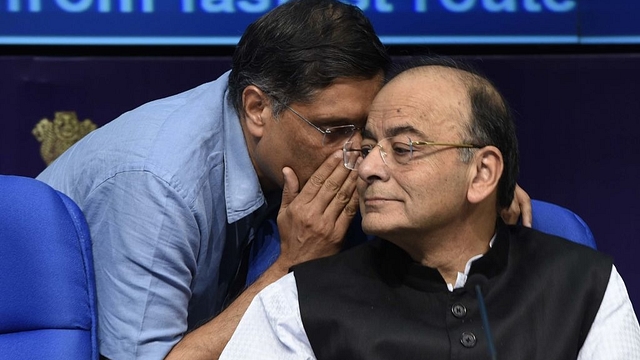 Chief Economic Adviser Arvind Subramanian talking to Finance Minister Arun Jaitley during a press conference in New Delhi, India. (Arvind Yadav/Hindustan Times via GettyImages)&nbsp;