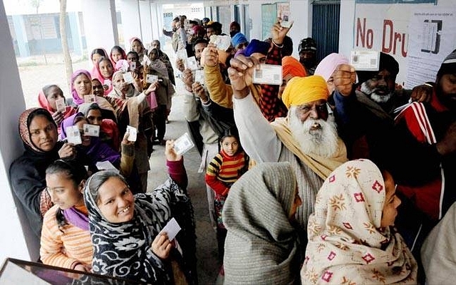 People line up to vote in Punjab. (PTI) 