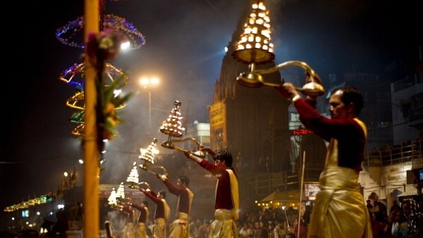 Hindu priests offer evening prayers on the banks of the River Ganges in Varanasi. (MANAN VATSYAYANA/AFP/Getty Images)