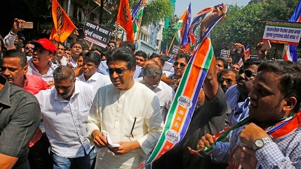 MNS chief Raj Thackeray and party activists participate in a protest rally. (PTI)