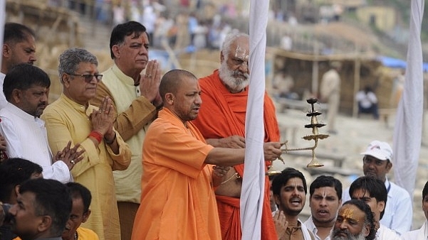 Uttar Pradesh Chief Minister Yogi Adityanath doing arti at Sarayu River ghat in Ayodhya. (Deepak Gupta/Hindustan Times via Getty Images)