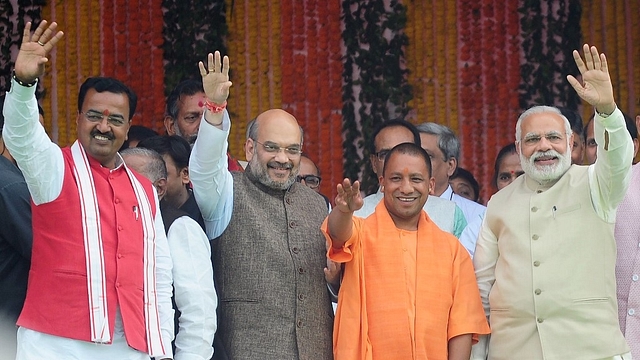 Chief Minister of Uttar Pradesh state Yogi Adityanath (C),  Prime Minister Narendra Modi (R), Bharatiya Janata Party (BJP) president Amit Shah and new deputy chief minister of Uttar Pradesh Keshav Prasad Maurya (L)(Sanjay Kanojia/AFP/Getty Images)