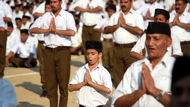 RSS volunteers performing yoga (Nitin Kanotra/Hindustan Times via Getty Images)