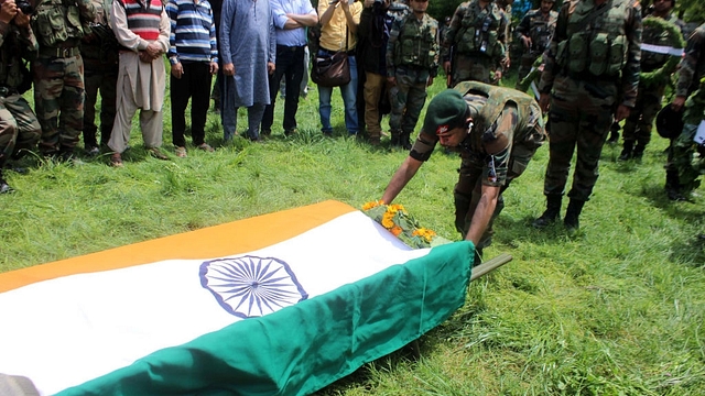 Army soldiers pay tribute to their colleague Lieutenant Umar Fayaz Parray during his funeral procession at Sudsun Yaripora village, in Kulgam. (Waseem Andrabi/Hindustan Times via Getty Images)&nbsp;