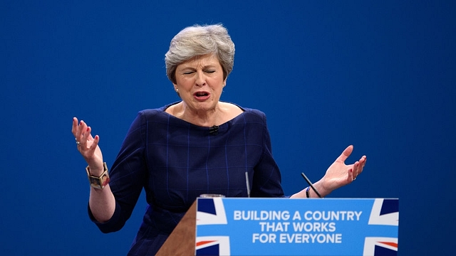  British Prime Minister Theresa May delivers her keynote speech to delegates and party members on the last day of the Conservative Party Conference at Manchester Central on October 4, 2017 in Manchester, England. The prime minister rallied members and called for the party to ‘shape up’ and ‘go forward together’. Theresa May also announced a major programme to build council houses and a cap on energy prices. (Carl Court/Getty Images)