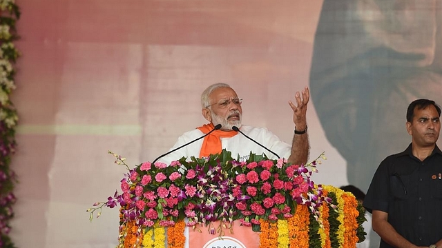 Indian Prime Minister Narendra Modi addresses a gathering of Bhartiya Janta Party supporters during Gujarat Gaurav Mahasamellan at Bhaat village on the outskirts of Ahmedabad. (SAM PANTHAKY/AFP/GettyImages)&nbsp;