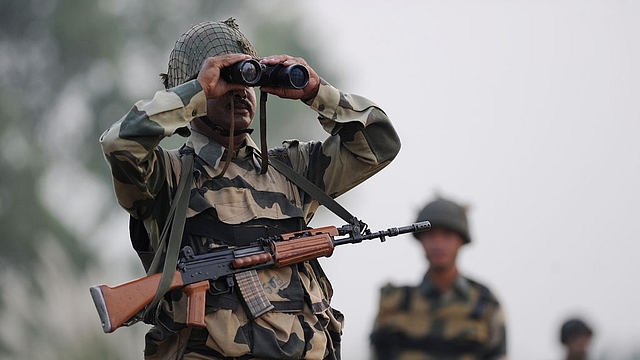  Indian Border Security Force (BSF) soldier looks through a binocular towards Pakistan during a patrol at the India-Pakistan border in R.S Pora, southwest of Jammu (TAUSEEF MUSTAFA/AFP/Getty Images)