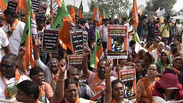  BJP supporters shout slogans during a ‘Jana Raksha Yatra’ from Central Park to CPI-M office in New Delhi, India. (Vipin Kumar/Hindustan Times via Getty Images)