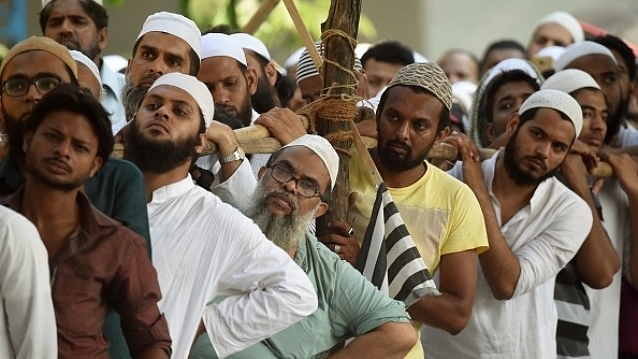 Indian Muslims take part in a protest rally against the implementation of a uniform civil code. (PUNIT PARANJPE/AFP/Getty Images)